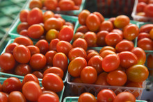 Grape Tomatoes In Basket At Market