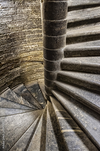 Tapeta ścienna na wymiar Vintage old spiral stone staircase in the style of grunge