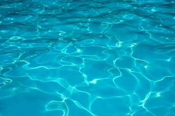 Wall Mural - Blue water surface in swimming pool