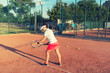 © aboutmomentsimages - Tennis sportswoman playing on clay court. Healthy fitness, atractive girl playing tennis