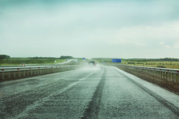 Wall Mural - cars go on the highway to rain