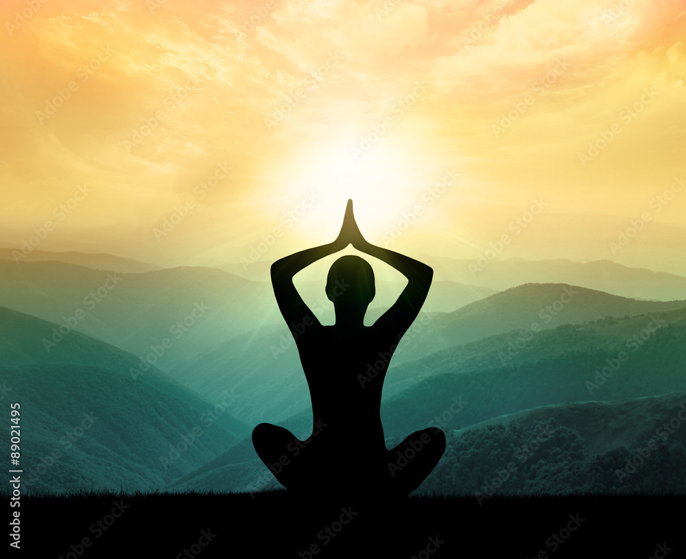 Yoga and meditation. Silhouette of man in moontains. - obrazy, fototapety, plakaty 