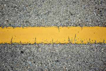 Wall Mural - old asphalt texture with yellow line