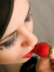 Sticker - Young woman eating strawberry