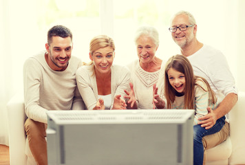 Canvas Print - happy family watching tv at home