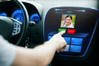 © Syda Productions - male hand receiving video call on car panel screen