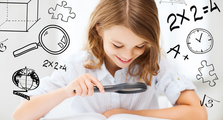 Wall Mural - girl reading book with magnifier at school