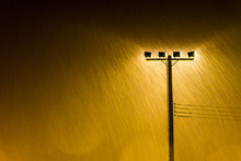 Soft Shot Of Night Street Lamp Lights In Heavy Rain, Rainstorm,Grained Image.
