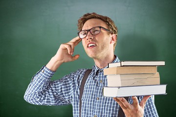 Sticker - Composite image of geeky student holding a pile of books