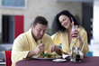 © Denizo - Cute couple in bathrobes having breakfast together at hotel