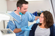 © Production Perig - Young attractive dentist explaning his work to a patient