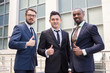 © master1305 - Portrait of business team holding their thumbs up