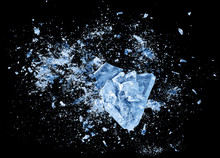 Abstract Blue Ice Crash Explosion Parts On Black Background. Collision, Suspension Crystal Ice Cubes Damage.