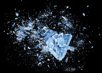 abstract blue ice crash explosion parts on black background. collision, suspension crystal ice cubes