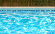 Picture Of Water At The Surface Of A Swimming Pool Including Tiled Side And Pool Edge. With Copy Space