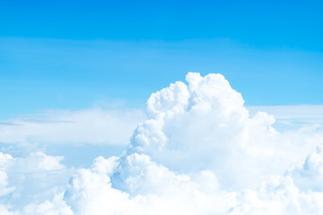 Wall Mural - aerial view of blue sky and cloud top view from airplane window,