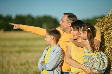 Wall Mural - Happy family in wheat field