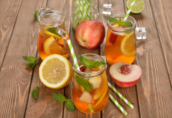 Wall Mural - Ice tea with lemon, peach and mint