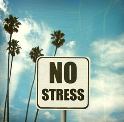 Wall Mural - aged and worn vintage no stress sign with palm trees