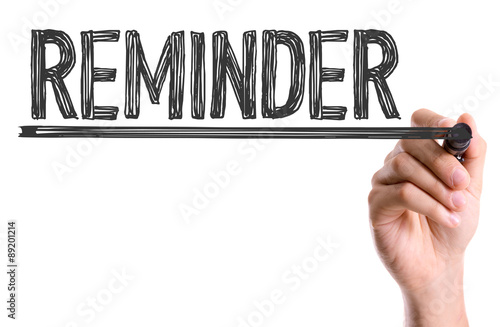 Fotomural Hand with marker writing the word Reminder