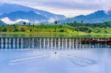 Wall Mural - a boat and a wooden bridge in the fresh morning