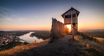 Canvas Print - Wooden Tourist Observation Tower above a Little City with River