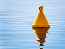 The Yellow Buoy In The Sea