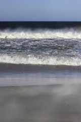 Waves breaking on the shore Bertha's Beach. Falkland Islands.