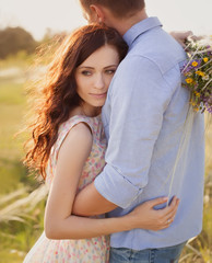 beautiful brunette woman in love hugging her boyfriend