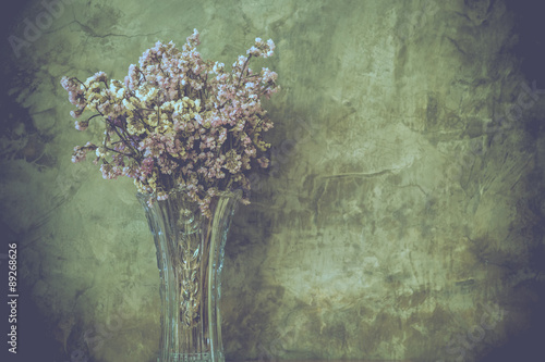 Dry flower in tall and transparent vase