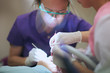 Traditional restorative dentistry; hands of a dentist in focus