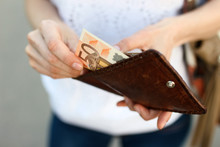 Girl Is Taking Out Fifty-euro Banknote From Her Leather Wallet