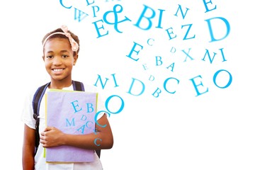 Sticker - Composite image of little girl holding folders in school 