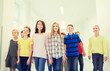 © Syda Productions - group of smiling school kids walking in corridor
