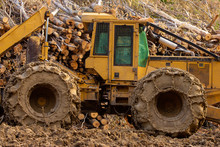 Mud Covered Heavy Duty Logging Tractor.