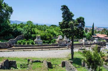 people are walking down the historical center of former city f pompeii near italian naples.