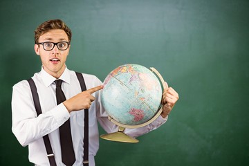 Sticker - Composite image of geeky businessman pointing to globe