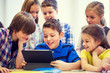 © Syda Productions - group of school kids with tablet pc in classroom