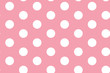 Big white polka dots on pink background seamless pattern