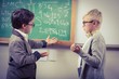 © WavebreakmediaMicro - Pupils dressed up as teachers discussing in a classroom
