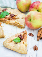 Wall Mural - Piece of homemade fresh apple galette with pecan nuts