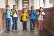 © WavebreakMediaMicro - Cute pupils with schoolbags standing at corridor