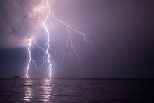 Spectacular Lightnings Striking The Sea During The Night