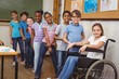 © WavebreakmediaMicro - Disabled pupil smiling at camera with classmates