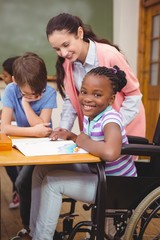 Wall Mural - Disabled pupil smiling at camera in classroom