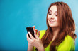 © Voyagerix - Teenage girl with mobile phone texting
