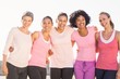 Smiling women wearing pink for breast cancer