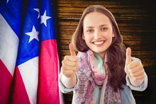 Composite Image Of Woman Showing Thumbs Up