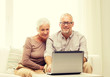 © Syda Productions - happy senior couple with laptop at home