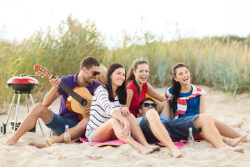 Wall Mural - group of happy friends having fun on beach